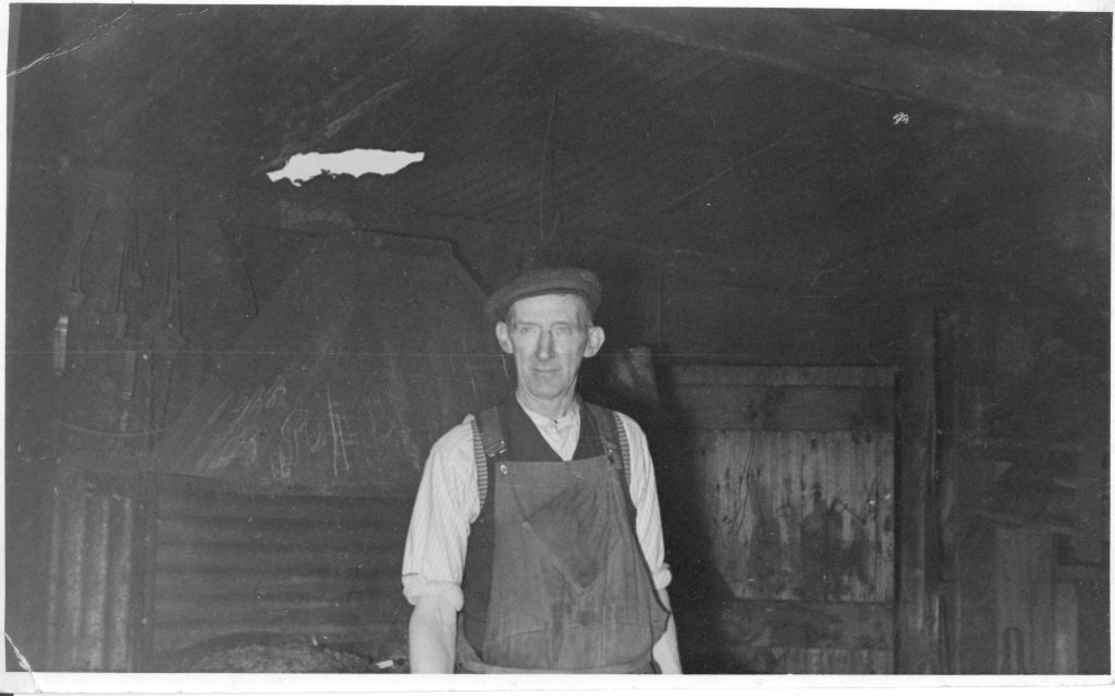 The Smith, Bert Malkin, in the Hankelow Smithy - date unknown