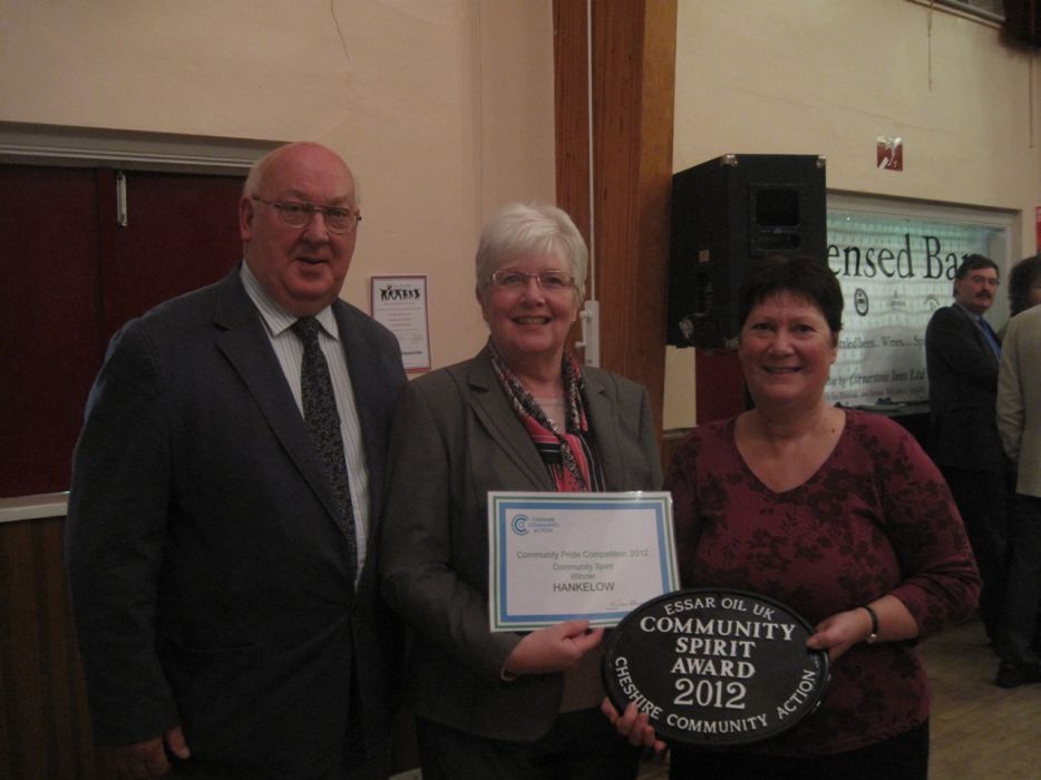 Hankelow Parish Councillor Ian Jones, Ann Jones and Val Morrey show the wall plaque and certificate