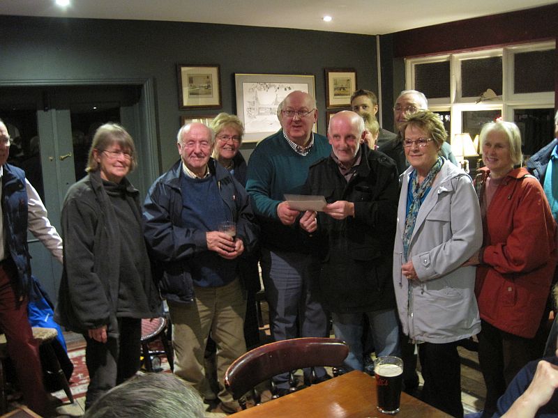 Malcolm Chalky White being presented with his retirement present from Hankelow citzens