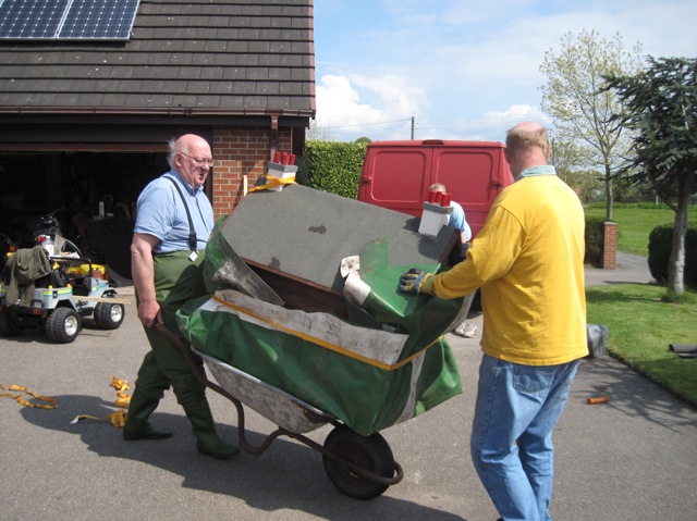 Ian Jones and Nigel Young transport it to the pond